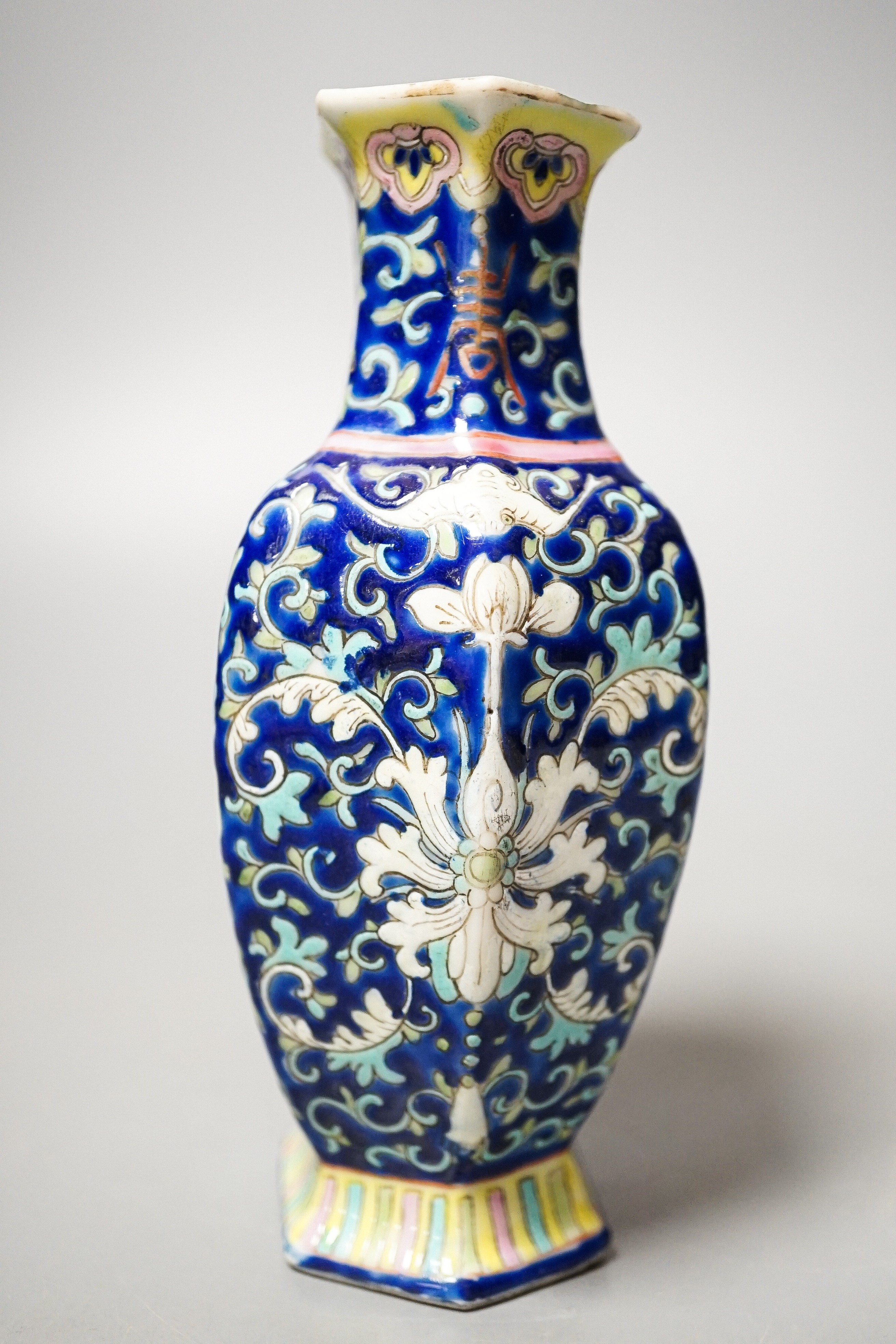 A Chinese blue ground famille rose hexagonal vase, late 19th century, 15cm
